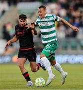 9 May 2025; Graham Burke of Shamrock Rovers in action against Luke Heeney of Drogheda United during the SSE Airtricity Men's Premier Division match between Shamrock Rovers and Drogheda United at Tallaght Stadium in Dublin. Photo by Thomas Flinkow/Sportsfile