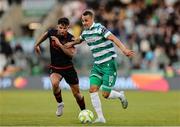 9 May 2025; Graham Burke of Shamrock Rovers in action against Luke Heeney of Drogheda United during the SSE Airtricity Men's Premier Division match between Shamrock Rovers and Drogheda United at Tallaght Stadium in Dublin. Photo by Thomas Flinkow/Sportsfile