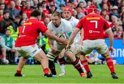 9 May 2025; Iain Henderson of Ulster is tackled by Michael Milne and John Hodnett of Munster during the United Rugby Championship match between Munster and Ulster at Thomond Park in Limerick. Photo by John Dickson/Sportsfile
