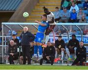 9 May 2025; Tommy Lonegan of Waterford in action against Jeannot Esua of Galway United during the SSE Airtricity Men's Premier Division match between Waterford and Galway United at the Regional Sports Centre in Waterford. Photo by Matt Browne/Sportsfile