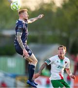 9 May 2025; Carl Winchester of Derry City in action against Evan McLaughlin of Cork City during the SSE Airtricity Men's Premier Division match between Cork City and Derry City at Turner's Cross in Cork. Photo by Michael P Ryan/Sportsfile