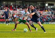 9 May 2025; Mark Connolly of Derry City in action against Harry Nevin of Cork City during the SSE Airtricity Men's Premier Division match between Cork City and Derry City at Turner's Cross in Cork. Photo by Michael P Ryan/Sportsfile
