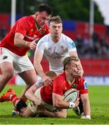 9 May 2025; Craig Casey of Munster is tackled by Jack Murphy of Ulster during the United Rugby Championship match between Munster and Ulster at Thomond Park in Limerick. Photo by Brendan Moran/Sportsfile