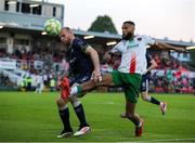 9 May 2025; Djenairo Daniels of Cork City in action against Mark Connolly of Derry City during the SSE Airtricity Men's Premier Division match between Cork City and Derry City at Turner's Cross in Cork. Photo by Michael P Ryan/Sportsfile