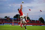 9 May 2025; Peter O'Mahony of Munster catches the ball ahead of Nathan Doak of Ulster on the way to scoring his side's sixth try during the United Rugby Championship match between Munster and Ulster at Thomond Park in Limerick. Photo by Brendan Moran/Sportsfile