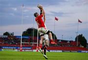 9 May 2025; Peter O'Mahony of Munster catches the ball ahead of Nathan Doak of Ulster on the way to scoring his side's sixth try during the United Rugby Championship match between Munster and Ulster at Thomond Park in Limerick. Photo by Brendan Moran/Sportsfile