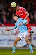 9 May 2025; JJ Lunney of Shelbourne beats Mason Melia of St Patrick's Athletic to a header during the SSE Airtricity Men's Premier Division match between Shelbourne and St Patrick's Athletic at Tolka Park in Dublin. Photo by Piaras Ó Mídheach/Sportsfile