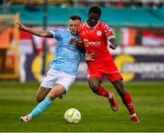 9 May 2025; Mipo Odubeko of Shelbourne in action against Jamie Lennon of St Patrick's Athletic during the SSE Airtricity Men's Premier Division match between Shelbourne and St Patrick's Athletic at Tolka Park in Dublin. Photo by Piaras Ó Mídheach/Sportsfile