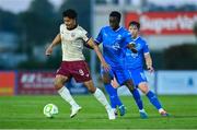 9 May 2025; Moses Dyer of Galway United in action against James Olayinka of Waterford during the SSE Airtricity Men's Premier Division match between Waterford and Galway United at the Regional Sports Centre in Waterford. Photo by Matt Browne/Sportsfile
