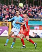 9 May 2025; Mason Melia of St Patrick's Athletic in action against JJ Lunney of Shelbourne during the SSE Airtricity Men's Premier Division match between Shelbourne and St Patrick's Athletic at Tolka Park in Dublin. Photo by Piaras Ó Mídheach/Sportsfile