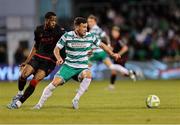 9 May 2025; Aaron Greene of Shamrock Rovers in action against Elicha Ahui of Drogheda United during the SSE Airtricity Men's Premier Division match between Shamrock Rovers and Drogheda United at Tallaght Stadium in Dublin. Photo by Thomas Flinkow/Sportsfile