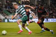 9 May 2025; Michael Noonan of Shamrock Rovers in action against Elicha Ahui of Drogheda United during the SSE Airtricity Men's Premier Division match between Shamrock Rovers and Drogheda United at Tallaght Stadium in Dublin. Photo by David Fitzgerald/Sportsfile