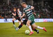 9 May 2025; Michael Noonan of Shamrock Rovers in action against Elicha Ahui of Drogheda United during the SSE Airtricity Men's Premier Division match between Shamrock Rovers and Drogheda United at Tallaght Stadium in Dublin. Photo by David Fitzgerald/Sportsfile