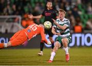 9 May 2025; Drogheda United goalkeeper Luke Dennison heads the ball off Michael Noonan of Shamrock Rovers in the build up to their third goal during the SSE Airtricity Men's Premier Division match between Shamrock Rovers and Drogheda United at Tallaght Stadium in Dublin. Photo by David Fitzgerald/Sportsfile