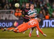 9 May 2025; Drogheda United goalkeeper Luke Dennison heads the ball off Michael Noonan of Shamrock Rovers in the build up to their third goal during the SSE Airtricity Men's Premier Division match between Shamrock Rovers and Drogheda United at Tallaght Stadium in Dublin. Photo by David Fitzgerald/Sportsfile