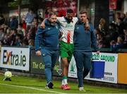 9 May 2025; Djenairo Daniels of Cork City leaves the field after picking up an injury during the SSE Airtricity Men's Premier Division match between Cork City and Derry City at Turner's Cross in Cork. Photo by Michael P Ryan/Sportsfile