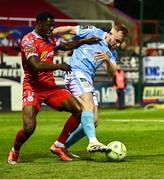 9 May 2025; Sean Hoare of St Patrick's Athletic in action against Mipo Odubeko of Shelbourne during the SSE Airtricity Men's Premier Division match between Shelbourne and St Patrick's Athletic at Tolka Park in Dublin. Photo by Piaras Ó Mídheach/Sportsfile