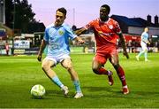 9 May 2025; Axel Sjoberg of St Patrick's Athletic in action against Mipo Odubeko of Shelbourne during the SSE Airtricity Men's Premier Division match between Shelbourne and St Patrick's Athletic at Tolka Park in Dublin. Photo by Piaras Ó Mídheach/Sportsfile