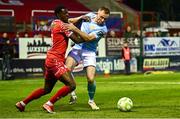 9 May 2025; Sean Hoare of St Patrick's Athletic in action against Mipo Odubeko of Shelbourne during the SSE Airtricity Men's Premier Division match between Shelbourne and St Patrick's Athletic at Tolka Park in Dublin. Photo by Piaras Ó Mídheach/Sportsfile