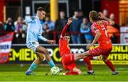 9 May 2025; Mason Melia of St Patrick's Athletic in action against Sean Gannon and Harry Wood, right, of Shelbourne during the SSE Airtricity Men's Premier Division match between Shelbourne and St Patrick's Athletic at Tolka Park in Dublin. Photo by Piaras Ó Mídheach/Sportsfile