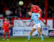 9 May 2025; JJ Lunney of Shelbourne beats Mason Melia of St Patrick's Athletic to a header during the SSE Airtricity Men's Premier Division match between Shelbourne and St Patrick's Athletic at Tolka Park in Dublin. Photo by Piaras Ó Mídheach/Sportsfile