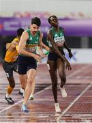10 May 2025; Rhasidat Adeleke of Ireland, right, passes the baton to teammate Cillín Greene, left, whilst competing in the mixed 4x400m relay during day one of the 2025 World Athletics Relays at Guangdong Olympic Stadium in Guangzhou, China. Photo by Nikola Krstic/Sportsfile