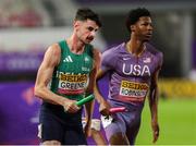 10 May 2025; Cillín Greene of Ireland, left, competes in the mixed 4x400m relay along side Chris Robinson of USA, during day one of the 2025 World Athletics Relays at Guangdong Olympic Stadium in Guangzhou, China. Photo by Nikola Krstic/Sportsfile