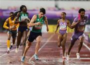10 May 2025; Cillín Greene of Ireland, left, competes in the mixed 4x400m relay along side Chris Robinson of USA, during day one of the 2025 World Athletics Relays at Guangdong Olympic Stadium in Guangzhou, China. Photo by Nikola Krstic/Sportsfile