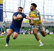 10 May 2025; Rónan Kelleher of Leinster beats the tackle  of Fetuli Paea of Zebre Parma on the way to scoring his side's frst try during the United Rugby Championship match between Leinster and Zebre Parma at the Aviva Stadium in Dublin. Photo by Brendan Moran/Sportsfile