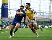 10 May 2025; Rónan Kelleher of Leinster beats the tackle  of Fetuli Paea of Zebre Parma on the way to scoring his side's frst try during the United Rugby Championship match between Leinster and Zebre Parma at the Aviva Stadium in Dublin. Photo by Brendan Moran/Sportsfile