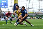 10 May 2025; Rónan Kelleher of Leinster beats the tackle  of Fetuli Paea of Zebre Parma on the way to scoring his side's frst try during the United Rugby Championship match between Leinster and Zebre Parma at the Aviva Stadium in Dublin. Photo by Brendan Moran/Sportsfile