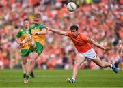 10 May 2025; Oisin Gallen of Donegal in action against Barry McCambridge of Armagh during the Ulster GAA Football Senior Championship final match between Armagh and Donegal at St Tiernach's Park in Clones, Monaghan. Photo by Ramsey Cardy/Sportsfile