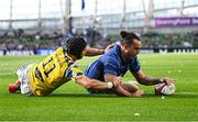 10 May 2025; James Lowe of Leinster scores his side's sixth try, despite the tackle of Zebre Parma's Simone Gesi, during the United Rugby Championship match between Leinster and Zebre Parma at the Aviva Stadium in Dublin. Photo by Seb Daly/Sportsfile