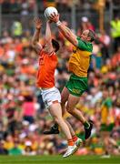 10 May 2025; Michael Murphy of Donegal in action against Jarly Óg Burns of Armagh during the Ulster GAA Football Senior Championship final match between Armagh and Donegal at St Tiernach's Park in Clones, Monaghan. Photo by Ramsey Cardy/Sportsfile