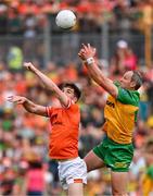 10 May 2025; Michael Murphy of Donegal in action against Jarly Óg Burns of Armagh during the Ulster GAA Football Senior Championship final match between Armagh and Donegal at St Tiernach's Park in Clones, Monaghan. Photo by Ramsey Cardy/Sportsfile