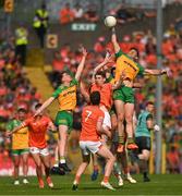 10 May 2025; Hugh McFadden of Donegal in action against Andrew Murnin of Armagh during the Ulster GAA Football Senior Championship final match between Armagh and Donegal at St Tiernach's Park in Clones, Monaghan. Photo by Ramsey Cardy/Sportsfile