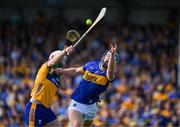 10 May 2025; Jason Forde of Tipperary in action against Conor Lean of Clare during the Munster GAA Hurling Senior Championship Round 3 match between Clare and Tipperary at Zimmer Biomet Páirc Chíosóg in Ennis, Clare. Photo by Ray McManus/Sportsfile