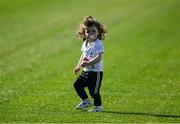 10 May 2025; Kildare supporter Katelyn Hyland, aged 1, from Athy, Co Kildare, niece of Kildare player David Hyland, plays on the pitch at halftime during the Táilteann Cup Round 1 match between Kildare and Leitrim at Cedral St Conleth's Park in Newbridge, Kildare. Photo by Daire Brennan/Sportsfile