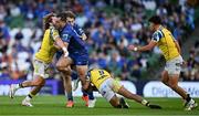 10 May 2025; James Lowe of Leinster is tackled by Bautista Stavile, left, and Gonzalo Garcia of Zebre Parma during the United Rugby Championship match between Leinster and Zebre Parma at the Aviva Stadium in Dublin. Photo by Brendan Moran/Sportsfile