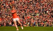 10 May 2025; Supporters watch on as Oisin O'Neill of Armagh kicks a free during the Ulster GAA Football Senior Championship final match between Armagh and Donegal at St Tiernach's Park in Clones, Monaghan. Photo by Ramsey Cardy/Sportsfile