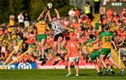 10 May 2025; Armagh goalkeeper Ethan Rafferty in action against Shane O'Donnell of Donegal during the Ulster GAA Football Senior Championship final match between Armagh and Donegal at St Tiernach's Park in Clones, Monaghan. Photo by Ramsey Cardy/Sportsfile