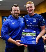 10 May 2025; Ciarán Frawley of Leinster is presented with a jersey by teammate Cian Healy, left, after his 100th Leinster cap following the United Rugby Championship match between Leinster and Zebre Parma at the Aviva Stadium in Dublin. Photo by Brendan Moran/Sportsfile