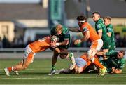 10 May 2025; Hugh Gavin of Connacht in action against Edinburgh players Mosese Tuipulotu, left, and Hamish Watson during the United Rugby Championship match between Connacht and Edinburgh at Dexcom Stadium in Galway. Photo by Thomas Flinkow/Sportsfile