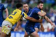 10 May 2025; Robbie Henshaw of Leinster is tackled by Fetuli Paea of Zebre Parma during the United Rugby Championship match between Leinster and Zebre Parma at the Aviva Stadium in Dublin. Photo by Brendan Moran/Sportsfile