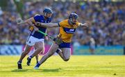 10 May 2025; David Fitzgerald of Clare is tackled by Alan Tynan of Tipperary during the Munster GAA Hurling Senior Championship Round 3 match between Clare and Tipperary at Zimmer Biomet Páirc Chíosóg in Ennis, Clare. Photo by Ray McManus/Sportsfile