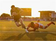 10 May 2025; Finn Treacy of Connacht on his way to scoring his side's first try despite the efforts of Sam Skinner of Edinburgh during the United Rugby Championship match between Connacht and Edinburgh at Dexcom Stadium in Galway. Photo by Thomas Flinkow/Sportsfile