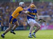 10 May 2025; Jake Morris of Tipperary is tackled by Cian Galvin of Clare during the Munster GAA Hurling Senior Championship Round 3 match between Clare and Tipperary at Zimmer Biomet Páirc Chíosóg in Ennis, Clare. Photo by Ray McManus/Sportsfile