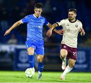 9 May 2025; Tommy Lonegan of Waterford in action against Colm Horgan of Galway United during the SSE Airtricity Men's Premier Division match between Waterford and Galway United at the Regional Sports Centre in Waterford. Photo by Matt Browne/Sportsfile