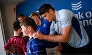 10 May 2025; Leinster players Tadhg Furlong, Tommy O'Brien and Alex Soroka with supporters in Autograph Alley before the United Rugby Championship match between Leinster and Zebre Parma at the Aviva Stadium in Dublin. Photo by Seb Daly/Sportsfile