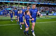 10 May 2025; Mascots walk out with Josh van der Flier, Jamie Osborne, Thomas Clarkson and Jack Boyle of Leinster before the United Rugby Championship match between Leinster and Zebre Parma at the Aviva Stadium in Dublin. Photo by Brendan Moran/Sportsfile